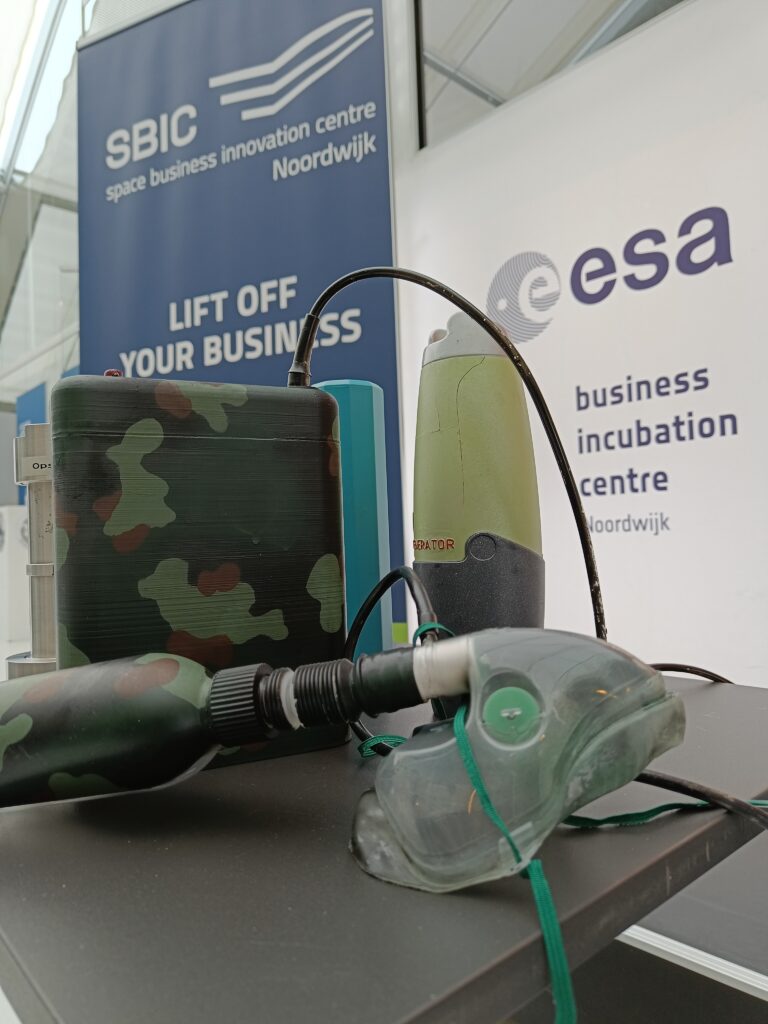 oxygen tank and case in camouflage print with oxygen mask on tableable